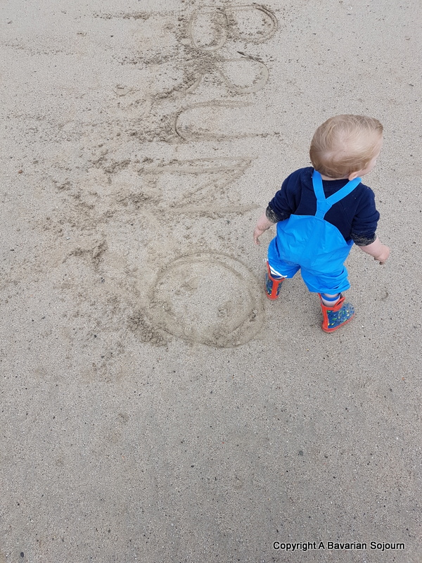 writing in the sand on Polzeath