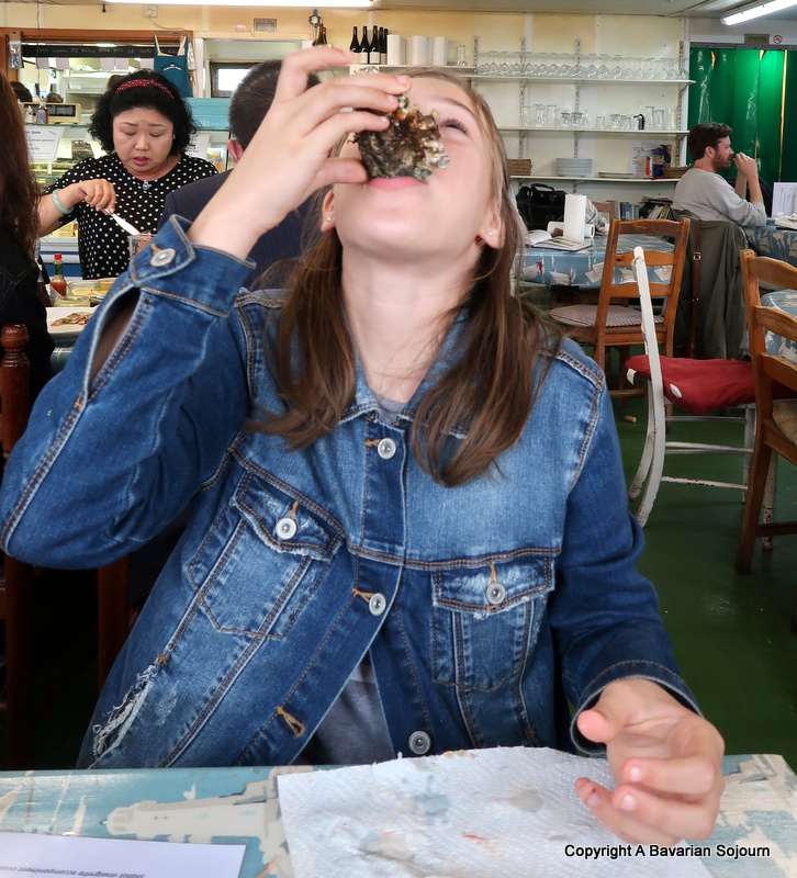 girl eating oysters